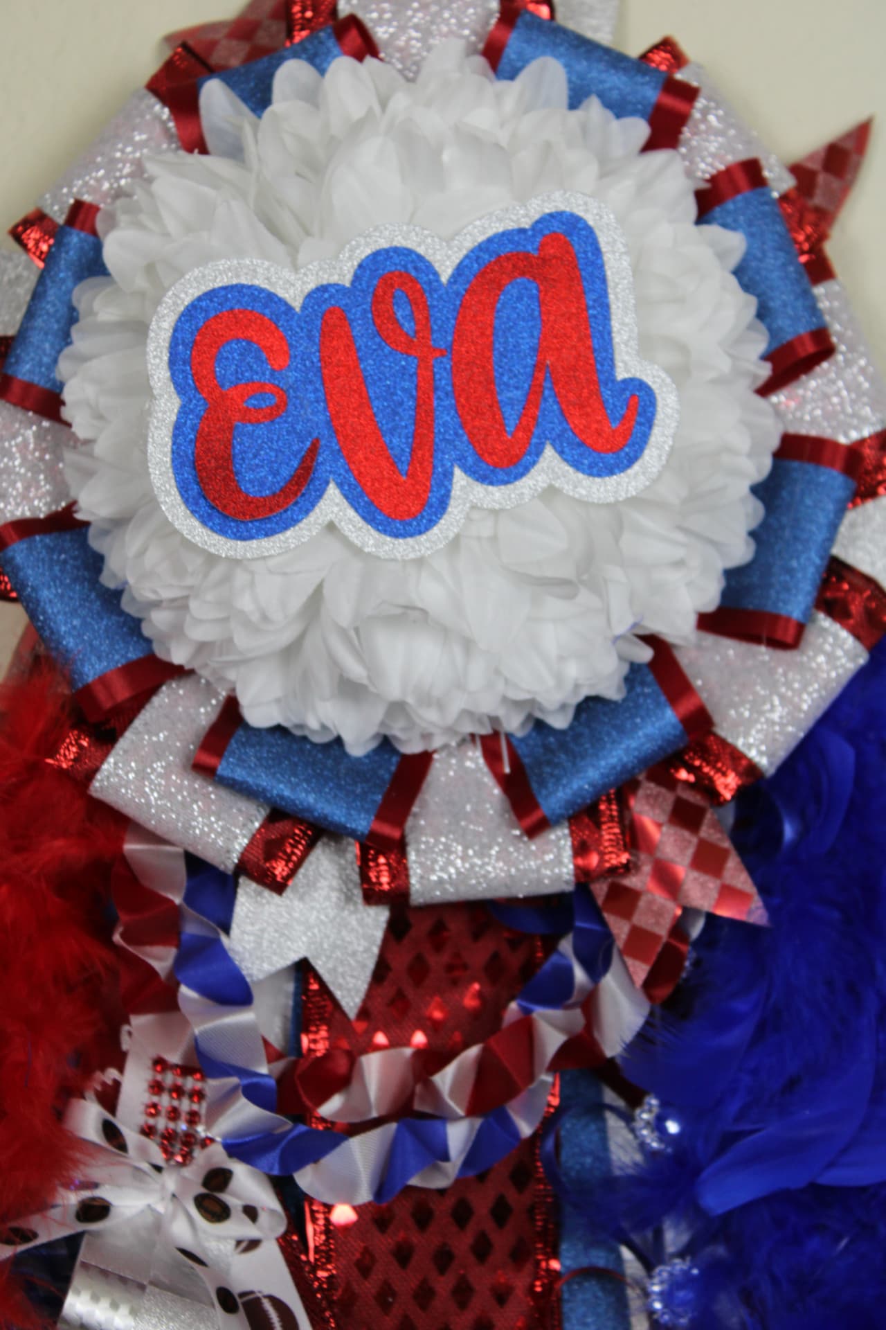 Large homecoming mum with EVA name cut-out and layered ribbons